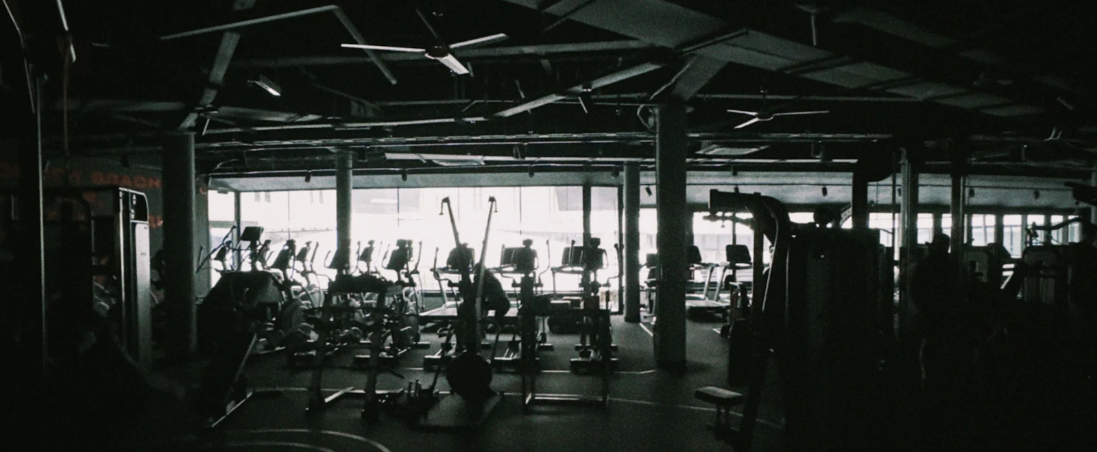 The studio floor at low light, equipment ready before a class.